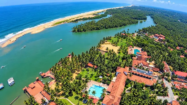 Aerial view of the Poovar estuary, island and golden sand beach
