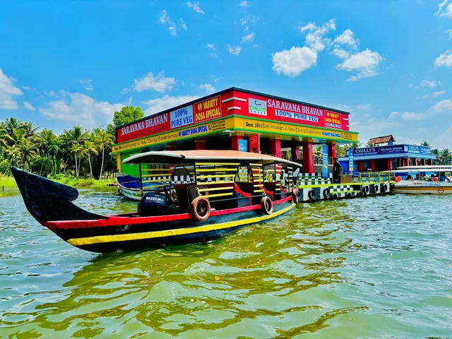 Saravana Bhavan floating restaurant and a Poovar boat