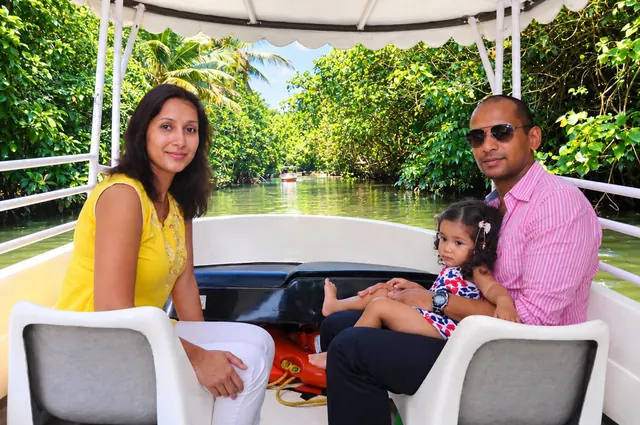 Family enjoying a Poovar boat ride
