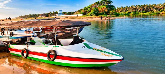 Poovar Boating Cruise boat at the golden sand beach