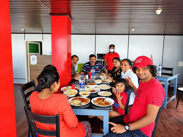 Guests having lunch at the Poovar floating restaurant