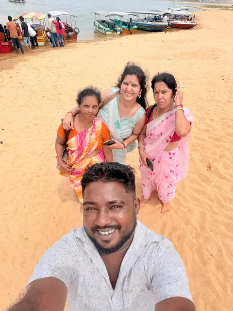 Guests taking a selfie on Poovar beach