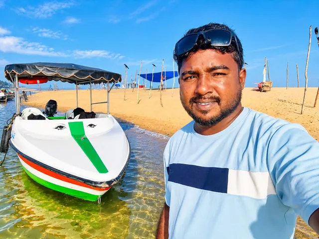 Guest selfie with a Poovar boat on the beach