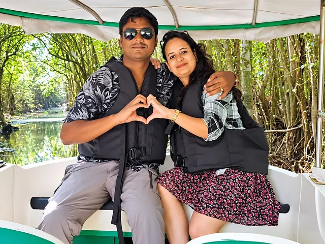 Happy couple on a private boat cruise through the Poovar mangroves – Couples Boating Cruise