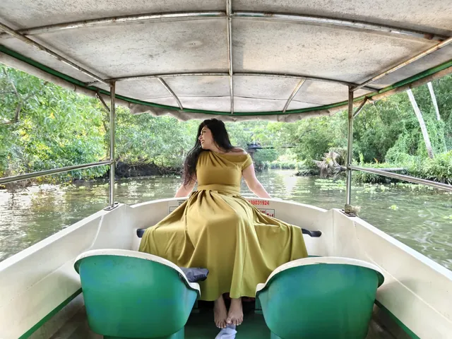 Solo guest relaxing on a Poovar boat cruise through the mangroves – Solo Trip Motor Boat Cruise
