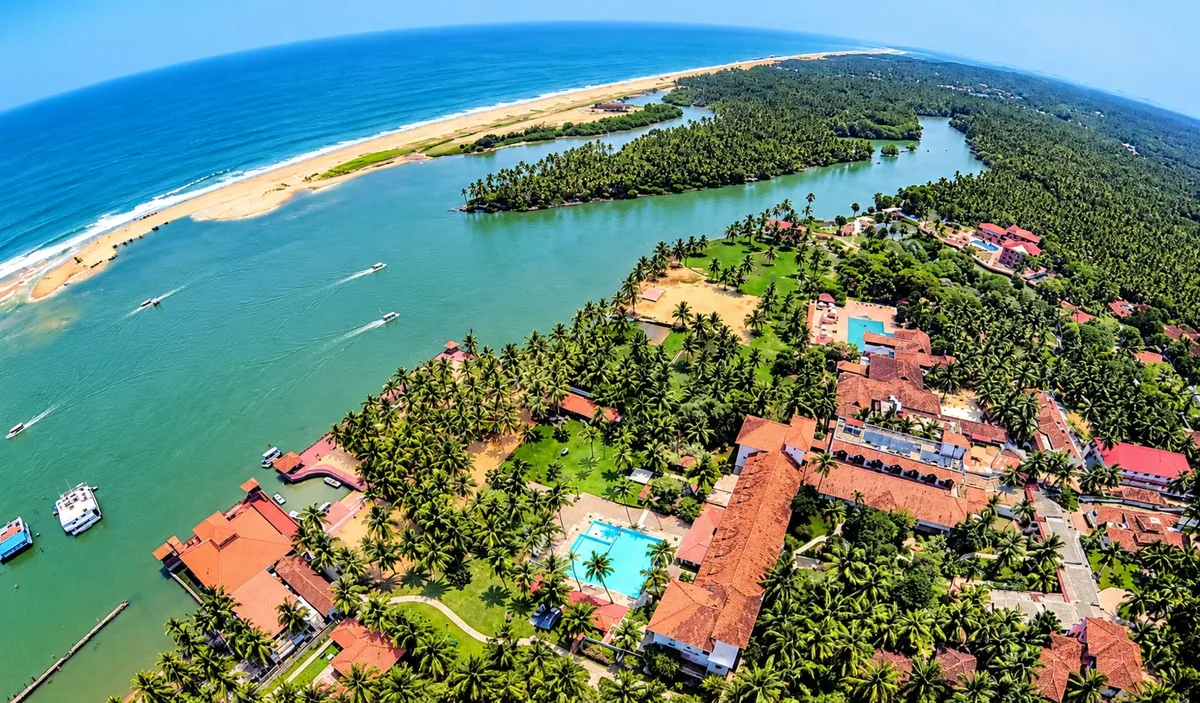 Aerial view of Poovar – the estuary, golden sand beach, Arabian Sea and backwater boats